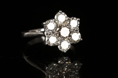 Lot 574 - An 18ct white gold and diamond floral cluster...