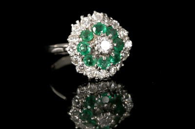 Lot 575 - An 18ct white gold, diamond and emerald set...