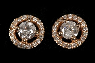 Lot 576 - A pair of 18ct rose gold and diamond set...