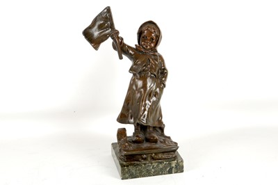 Lot 519 - An antique spelter figure of a child holding a...