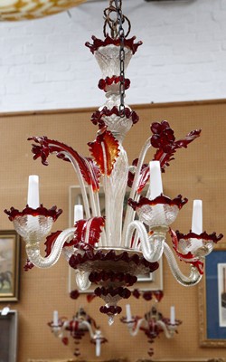 Lot 655 - A small four branch Murano cranberry glass...