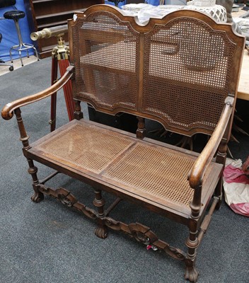 Lot 838 - An oak carolean style chair back 2 seater sofa...