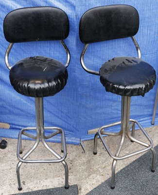 Lot 837 - Two tubular metal and vinyl covered bar stools...