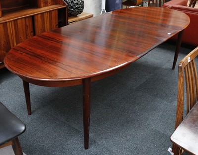 Lot 524 - A 1960s DANISH ROSEWOOD DINING TABLE, with two...