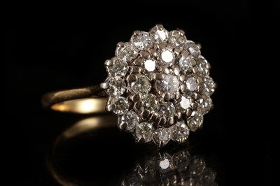 Lot 593 - An 18ct gold and diamond set floral cluster...