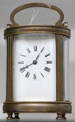 Lot 137 - Oval brass carriage clock, Roman numerals face,...