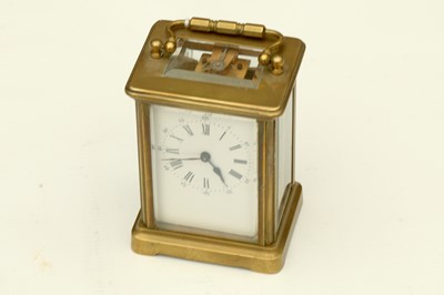 Lot 139 - Brass carriage clock, four glass sides, Roman...