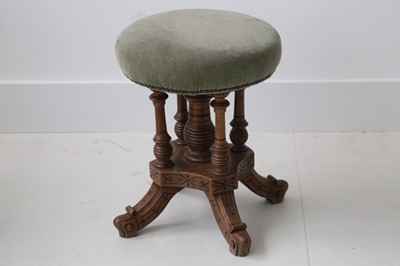 Lot 818 - Gothic revival oak piano stool, 'button' seat...