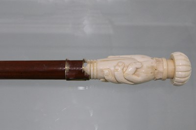 Lot 158 - A modern marine Ivory cane, the handle carved...