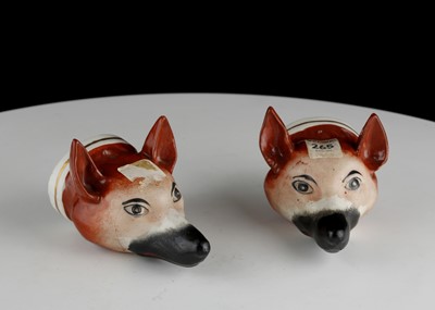 Lot 235 - A PAIR OF STAFFORDSHIRE FOX HEAD STIRRUP CUPS,...