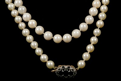 Lot 280 - Two single strand pearl necklaces with gold,...