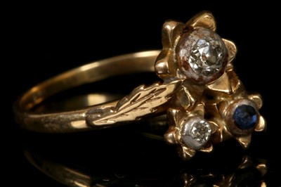 Lot 240 - An 18ct gold, diamond and sapphire set floral...