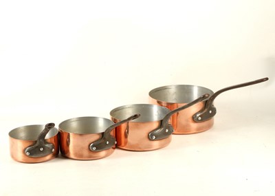 Lot 742 - A graduated set of 5 copper saucepans, iron...