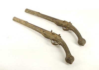 Lot 744 - A pair of Turkish brass cased flintlock...