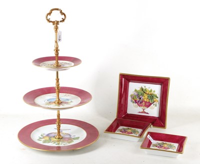 Lot 809 - A Limoges cake stand, triple deck with fruit...