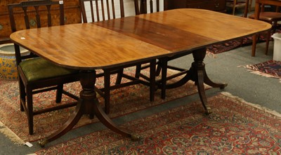 Lot 827 - A Regency style mahogany dining table with...