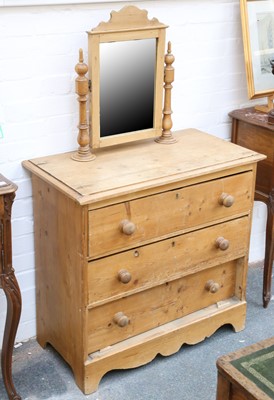 Lot 829 - A honey pine chest of drawers, with mirror on...