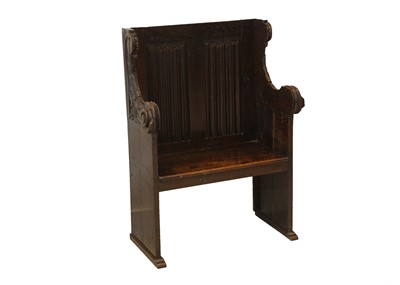 Lot 841 - A Victorian Gothic Revival carved oak settle...