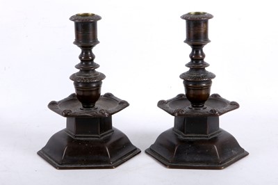 Lot 7 - A pair of Dutch patinated bronze candlesticks,...