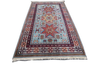 Lot 101 - A Turkish wool rug, pale blue ground,...