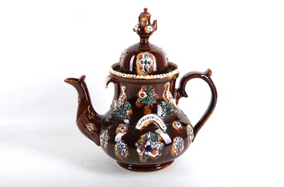 Lot 14 - A Victorian bargeware teapot, dated 1874, 39cm.