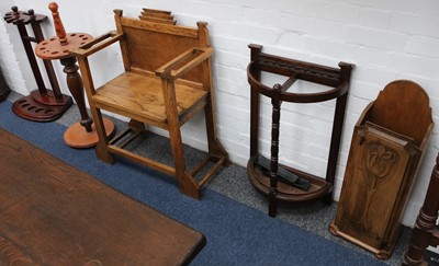 Lot 54 - A 1920's oak hall seat stick stand, together...