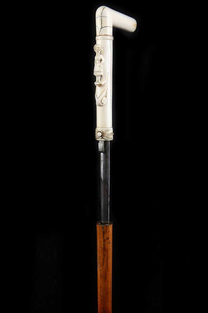 Lot 115 - A 19TH CENTURY IVORY HANDLED DAGGER STICK CANE,...