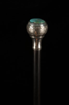 Lot 118 - AN IVORY AND EBONY CANE, with ivory knob and...