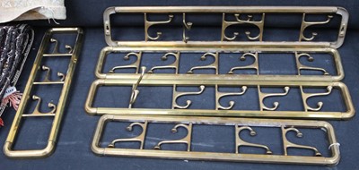 Lot 308 - Five brass wall hanging folding coat hooks.