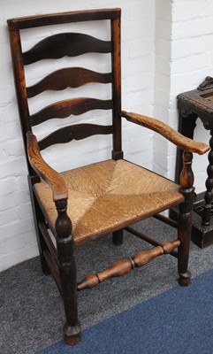 Lot 199 - A 19th Century elm ladder-back armchair with...