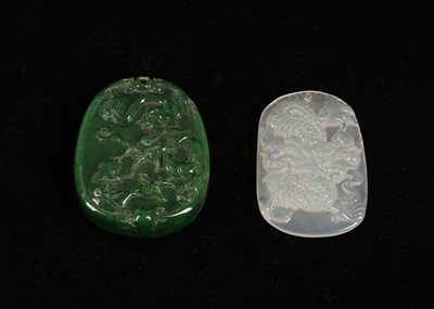 Lot 386 - Two Chinese jade pendants; white with dragon,...