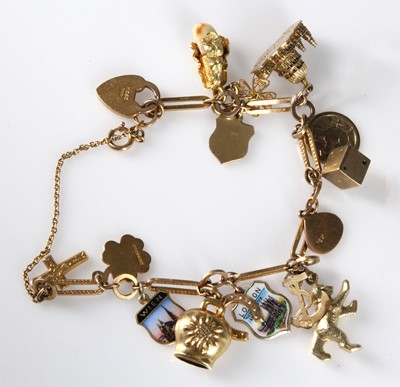 Lot 131 - A 20th Century 9ct gold ladies' charm bracelet...