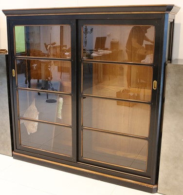 Lot 346 - A large ebonised and fully glazed display...