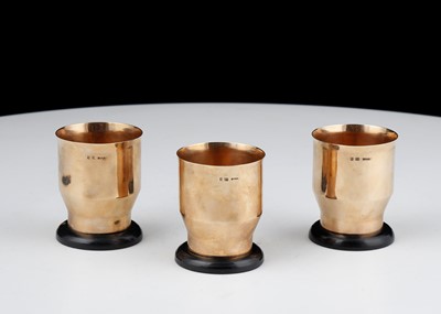 Lot 606 - Set of three 9ct Rose Gold egg cups maker’s...