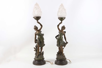 Lot 222 - A pair of continental bronzed figural lamps...