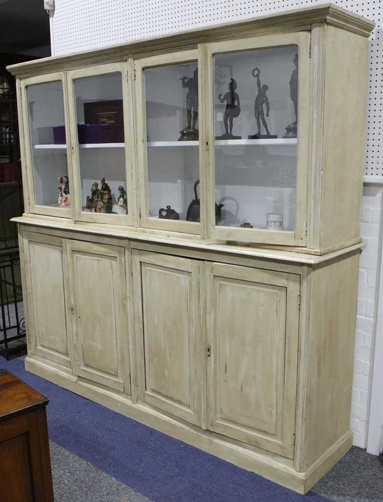 Lot 246 A cream painted four door dresser in two