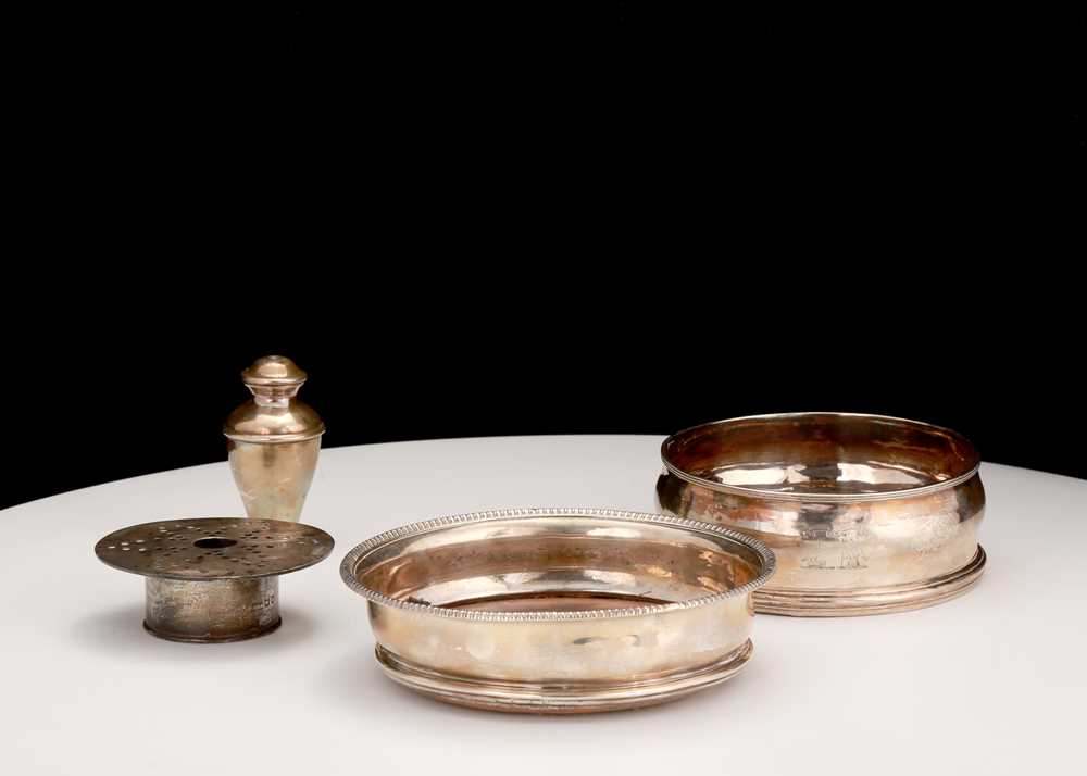 Lot 598 - Two antique sterling silver wine coaster, one...