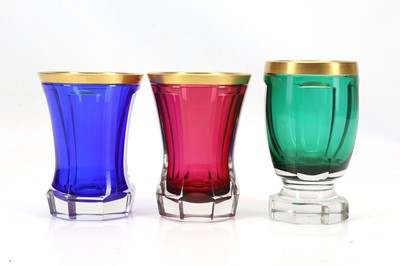 Lot 371 - THREE BOHEMIAN FACETED COLOURED GLASS BEAKERS,...