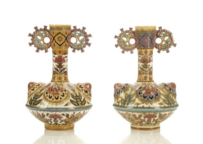 Lot 340 - A NEAR PAIR OF ZSOLNAY PÉCS POTTERY BOTTLE...