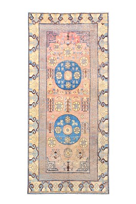 Lot 9 - AN ANTIQUE KHOTAN KELLEH, EAST TURKESTAN...