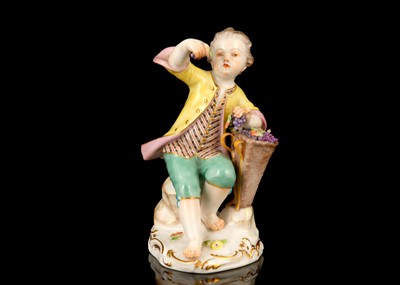 Lot 123 - A MEISSEN PORCELAIN FIGURE OF A BOY HOLDING...