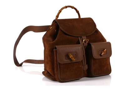 Lot 202 - Gucci brown suede and bamboo backpack, two...