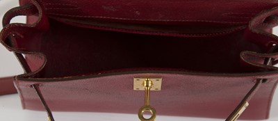Lot 229 - Hermes red Courchevel leather Mini Kelly 20, c....