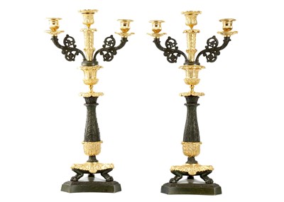Lot 129 - A PAIR OF GILT AND PATINATED BRONZE REGENCY...