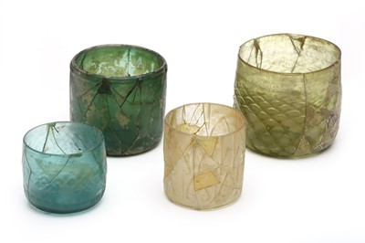 Lot 5 - FOUR NISHAPUR GLASS BEAKERS. Eastern Iranian....