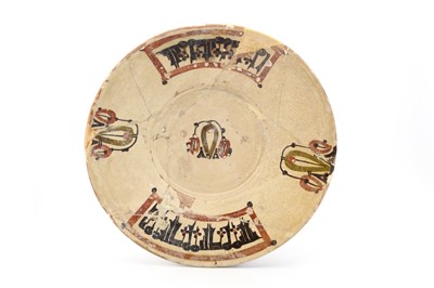 Lot 11 - A SAMANID SLIPWARE GLAZED CERAMIC DISH,...