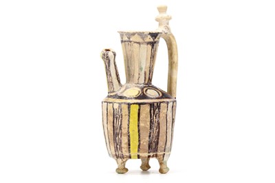 Lot 19 - AN ABBASID GLAZED CERAMIC FOOTED EWER. Iraq or...