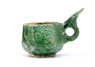 Lot 20 - AN UMAYYAD GREEN GLAZED CERAMIC MEASURING CUP,...