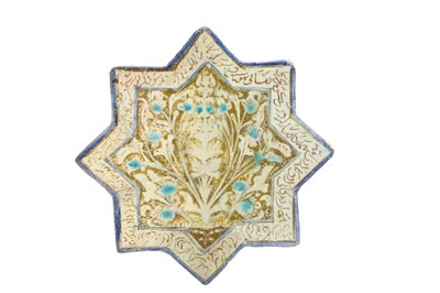 Lot 25 - A KASHAN STAR SHAPED GLAZED CERAMIC TILE, with...