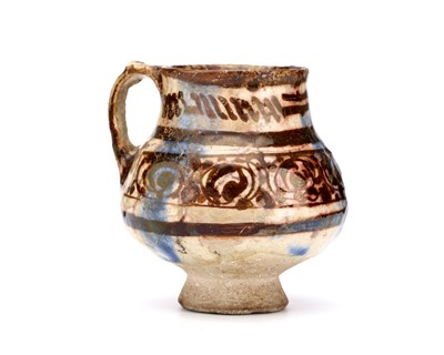 Lot 26 - A KASHAN COPPER LUSTRE CERAMIC JUG, decorated...